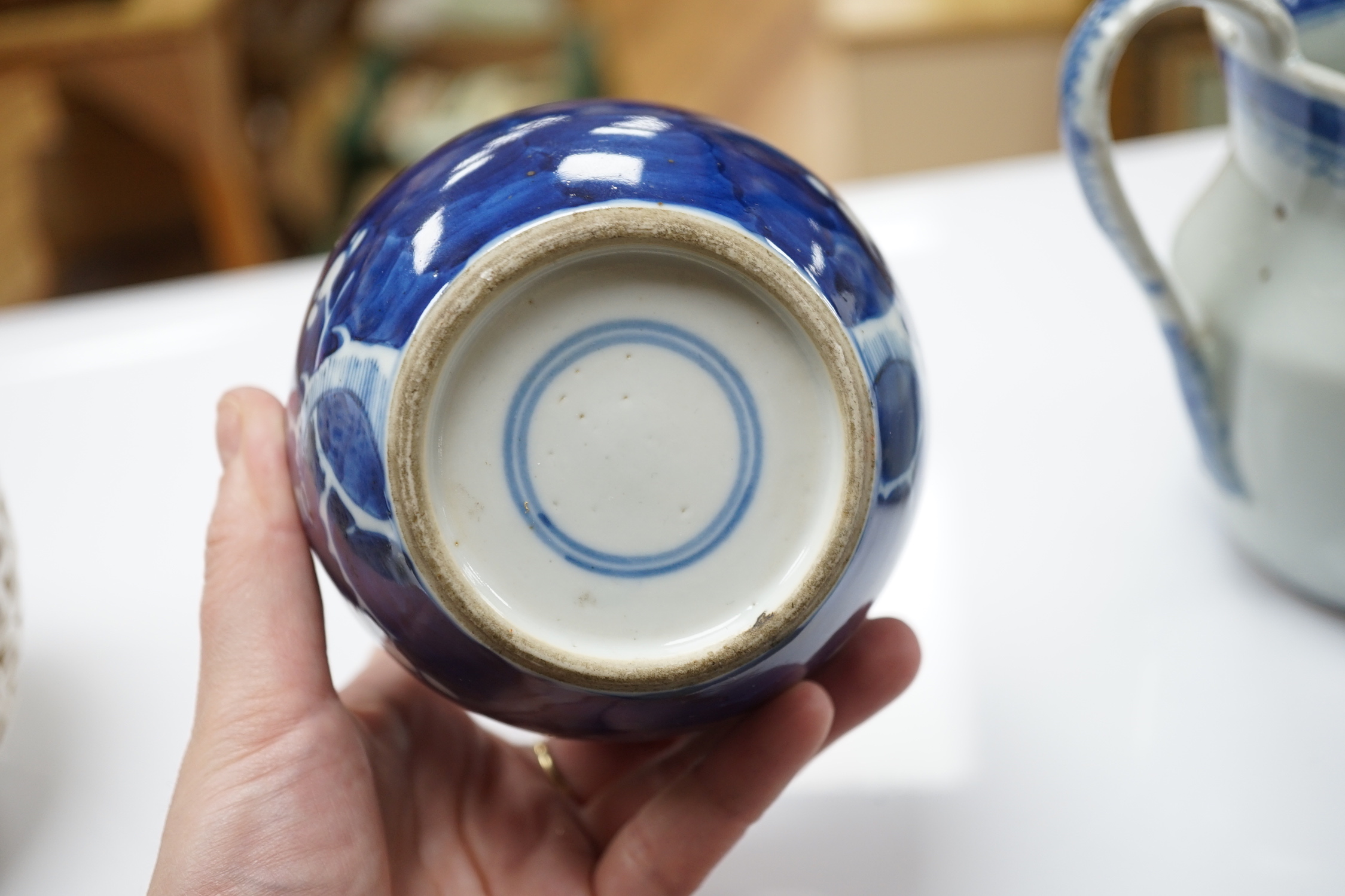 A 19th century Chinese blue and white jug, a similar jar and a pierced jar, tallest 15cm